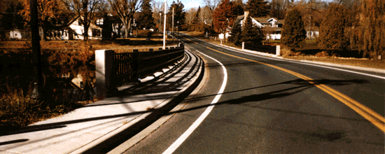 Curving road over bridge